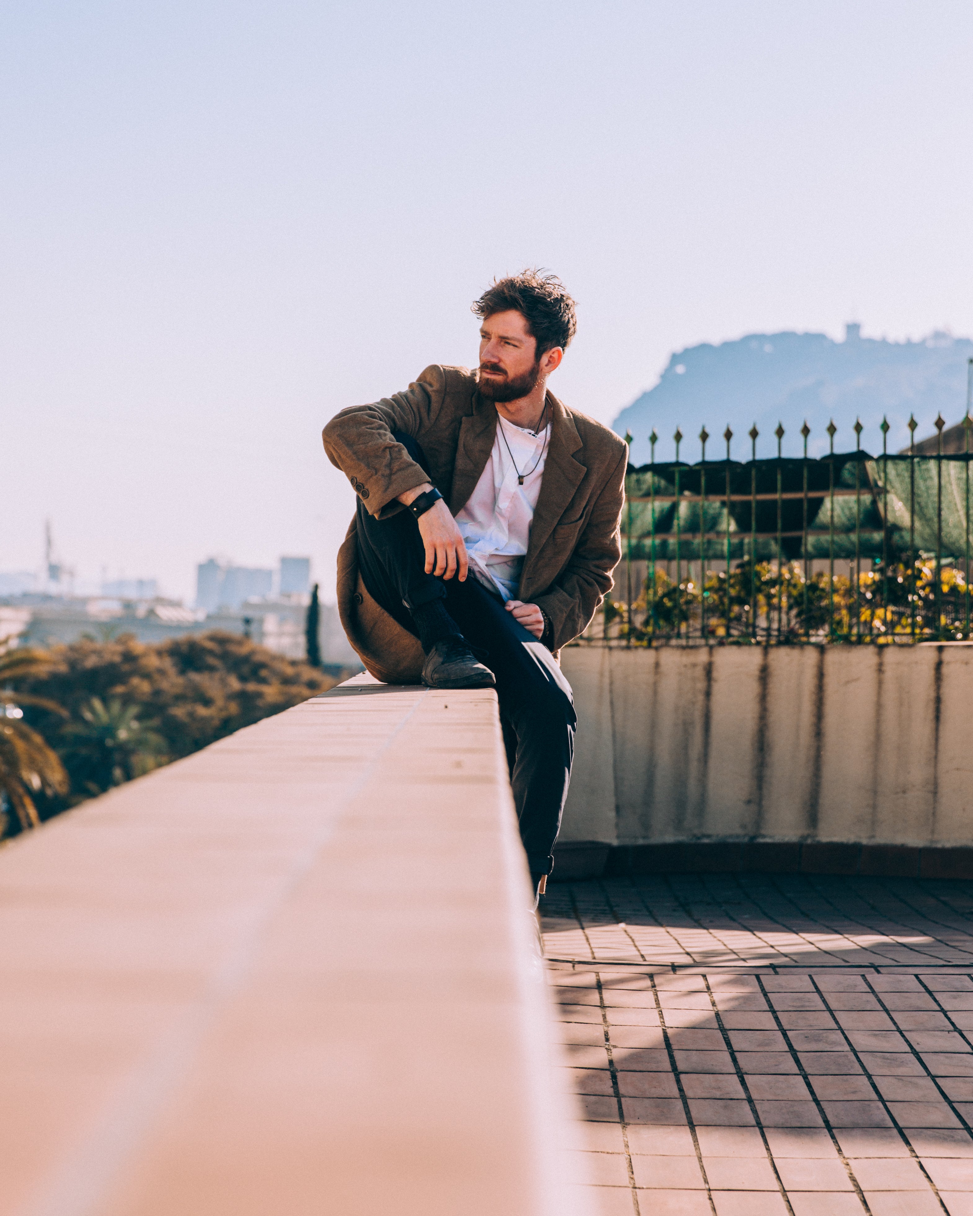 files/man-sitting-comfortably-on-roof-ledge.jpg